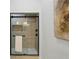 Glass door shower featuring sleek hardware and bright light at 2438 2Nd Nw St, Atlanta, GA 30318