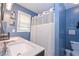 Full bathroom featuring a double vanity with modern fixtures and a shower with curtain at 324 Madeline Way, Temple, GA 30179