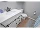 Bathroom featuring updated vanity with barn door access and modern fixtures at 324 Madeline Way, Temple, GA 30179