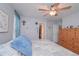 Bedroom with neutral walls, and carpet with ceiling fan, large dresser and closet at 324 Madeline Way, Temple, GA 30179