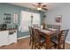 Charming dining area with a wood table, seating for six, and decorative accents at 324 Madeline Way, Temple, GA 30179
