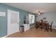 Bright dining room with a ceiling fan, a coffee bar and access to the backyard at 324 Madeline Way, Temple, GA 30179