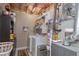 Well-organized laundry area with a washing machine and dryer, and lots of shelving at 324 Madeline Way, Temple, GA 30179