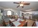 Open-concept living space connecting the dining room, kitchen, and living area for easy entertaining at 324 Madeline Way, Temple, GA 30179