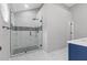 Modern bathroom boasts a glass shower with marble tile and matte black fixtures at 7074 Ravenwood Ln, Lithonia, GA 30038