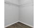 Walk-in closet space with white wire shelving and neutral paint at 7074 Ravenwood Ln, Lithonia, GA 30038