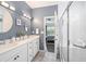 Elegant bathroom with a double sink vanity, modern fixtures, and a glass-enclosed shower at 123 Woodford Ln, Canton, GA 30115