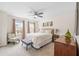 Bright bedroom featuring a comfortable bed, soft carpet, and natural light for a relaxing atmosphere at 123 Woodford Ln, Canton, GA 30115