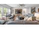 Inviting living room featuring a large built-in entertainment center and comfortable seating arrangement at 123 Woodford Ln, Canton, GA 30115