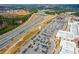 Aerial view of the Outlet Shoppes with an adjacent highway and parking lots at 164 Inwood Walk, Woodstock, GA 30188