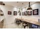 Dining area with metal chairs, industrial lighting, and sports memorabilia on the walls at 164 Inwood Walk, Woodstock, GA 30188