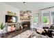 Close up on living room's wood-burning fireplace with decorative mantle and dark floors at 164 Inwood Walk, Woodstock, GA 30188