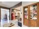 Game room features a display case, vintage refrigerator, and dining area at 164 Inwood Walk, Woodstock, GA 30188