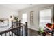 Hallway with natural light, hardwood floors and rustic decor at 164 Inwood Walk, Woodstock, GA 30188
