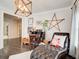 Comfortable living room featuring hardwood floors, chaise lounge and a piano at 164 Inwood Walk, Woodstock, GA 30188