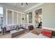 Comfortable seating on the screened porch, offering a cozy space for relaxation and enjoyment at 164 Inwood Walk, Woodstock, GA 30188