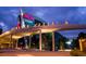 Night view of the modern Georgia Aquarium exterior, featuring unique architecture and vibrant lighting at 3268 Lions Ruby Ln, Atlanta, GA 30349