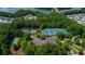 Stunning aerial view of community tennis courts with a parking area surrounded by trees and lush landscaping at 3501 Great Sky Pkwy, Canton, GA 30114