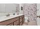 Bathroom with a double sink vanity, a decorative shower curtain, and wood-look flooring at 3501 Great Sky Pkwy, Canton, GA 30114
