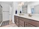 Bathroom features a double sink, a large mirror, and modern lighting at 3501 Great Sky Pkwy, Canton, GA 30114