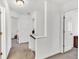 Upstairs hallway with neutral paint and carpet, and white doors and trim at 3501 Great Sky Pkwy, Canton, GA 30114