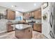 Well-lit kitchen with an island, modern appliances, granite countertops, and ample cabinet space at 3501 Great Sky Pkwy, Canton, GA 30114