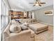 Open concept living room leading to the kitchen with a large sectional couch and neutral decor at 3501 Great Sky Pkwy, Canton, GA 30114