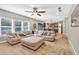 Open concept living room with hardwood floors and neutral decor leading to the kitchen and dining area at 3501 Great Sky Pkwy, Canton, GA 30114