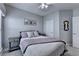 Cozy bedroom with neutral tones, ceiling fan, and stylish decor, creating a relaxing retreat at 4485 Cadmium Dr, Cumming, GA 30040