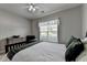 Serene bedroom showcasing a comfortable bed and a window with natural light at 4485 Cadmium Dr, Cumming, GA 30040