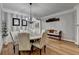 Chic dining area featuring stylish decor, wainscoting detail, and hardwood flooring at 4485 Cadmium Dr, Cumming, GA 30040