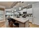 Well-lit kitchen boasting an island with seating and modern appliances, with an adjacent dining area at 4485 Cadmium Dr, Cumming, GA 30040