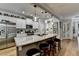 Bright kitchen featuring stainless steel appliances, a large island with bar seating, and pendant lighting at 4485 Cadmium Dr, Cumming, GA 30040
