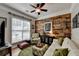 Charming living room with a decorative wood wall, a patterned chair, and plenty of natural light at 4485 Cadmium Dr, Cumming, GA 30040