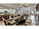 Open-concept living room featuring hardwood floors, a fireplace, and seamless access to the kitchen and dining area at 4485 Cadmium Dr, Cumming, GA 30040