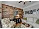 Comfortable living room featuring a stylish wood wall, cozy seating, and an artistic decor arrangement at 4485 Cadmium Dr, Cumming, GA 30040