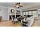 Cozy living room with a fireplace, built-in shelving, hardwood floors, and comfortable seating area at 4485 Cadmium Dr, Cumming, GA 30040