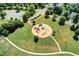 Community playground with modern play structures, a cushioned ground, and surrounding green space for children to enjoy at 4485 Cadmium Dr, Cumming, GA 30040