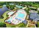 Aerial view of community pool, tennis courts, and clubhouse showcasing amenities and recreational facilities available to residents at 4485 Cadmium Dr, Cumming, GA 30040