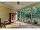 Cozy sunroom with tile flooring and large windows providing serene backyard views at 4485 Cadmium Dr, Cumming, GA 30040