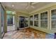 Relaxing sunroom with tile flooring, large windows, and a seamless connection to the outdoors at 4485 Cadmium Dr, Cumming, GA 30040