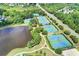 A high aerial shot showcases the community tennis courts, with multiple well-maintained courts available for residents at 4485 Cadmium Dr, Cumming, GA 30040