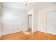 Bright bedroom featuring hardwood floors and a closet, and access to another room at 490 E Pharr Rd, Decatur, GA 30030