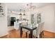Modern kitchen with stainless steel appliances, white cabinets, and breakfast bar at 490 E Pharr Rd, Decatur, GA 30030