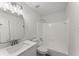 Well-lit bathroom with updated vanity, ample lighting, and shower-tub combination at 800 Breckinridge Sw Rd, Marietta, GA 30064