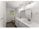 Bathroom with double vanity sinks, stylish lighting, and updated fixtures at 800 Breckinridge Sw Rd, Marietta, GA 30064