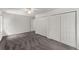 Spacious bedroom featuring neutral carpet, ceiling fan, and convenient closet doors at 800 Breckinridge Sw Rd, Marietta, GA 30064