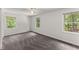 Bedroom featuring gray carpet, neutral colored walls, ceiling fan and wooded views at 800 Breckinridge Sw Rd, Marietta, GA 30064