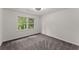 Bright bedroom with natural light from the window and neutral colored carpet at 800 Breckinridge Sw Rd, Marietta, GA 30064