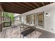 Outdoor deck space with modern furniture, french doors, and wooden floors at 800 Breckinridge Sw Rd, Marietta, GA 30064